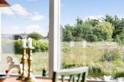 a window with a view of a field of grass at 114-Thisted-Tunvej-14 in Thisted