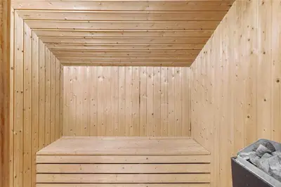 a wooden sauna with a wooden bench in it at 868-Thisted-Nordsovej-168 in Thisted