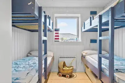 a bedroom with two bunk beds and a window at 635-Thisted-Store-Knuds-Vej-6 in Thisted