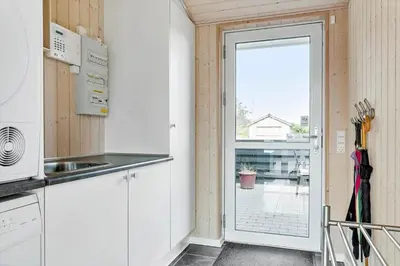 a kitchen with a door leading to a patio at 524-Thisted-Flyndervej-4 in Thisted