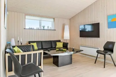 a living room with a couch and a table and chairs at 524-Thisted-Flyndervej-4 in Thisted
