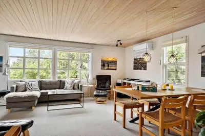 a living room with a couch and a table at 140-Vestervig-Bekkasinvej-14 in Vestervig