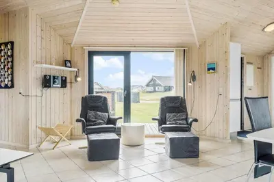 two chairs in a room with a large window at 939-Thisted-Niels-Vognmands-Vej-3 in Torsted