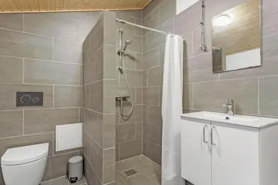 a bathroom with a shower and a toilet and a sink at 318-Thisted-Nordsovej-204-A in Thisted