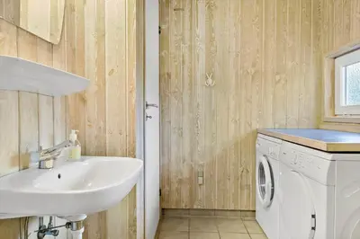 a bathroom with a sink and a washing machine at 970-Thisted-Klitstien-47 in Torsted
