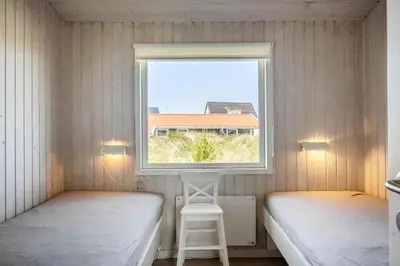 a small room with two beds and a window at 534-Thisted-Fiskervej-123 in Thisted