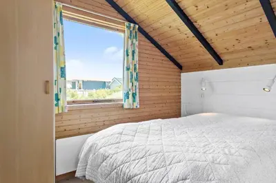 a bedroom with a bed and a window at 314-Thisted-Mose-Bollevej-14 in Thisted