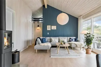 a living room with a couch and a table at 962-Thisted-Bavnbak-27 in Torsted