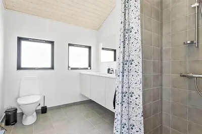 a white bathroom with a shower and a toilet at 786-Thisted-Flyndervej-6 in Thisted