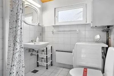 a small bathroom with a sink and a toilet at 767-Thisted-Nordsovej-63 in Thisted