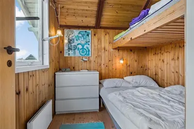 a small bedroom with a bunk bed and a window at 958-Thisted-Kobbelsti-22 in Torsted