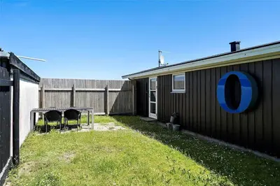 a backyard with a picnic table and a house at 1003-Thisted-Ajs-Molls-Vej-2 in Torsted