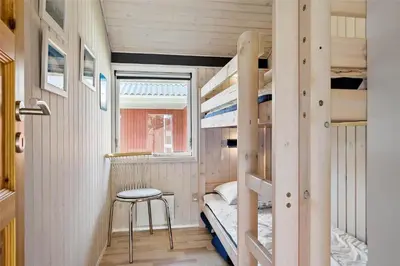 a tiny house with a bunk bed and a stool at 715-Thisted-Tunvej-22 in Thisted