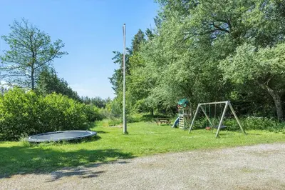 a playground with a trampoline and a swing set at 100-Thisted-Kapelvej-1 in Thisted