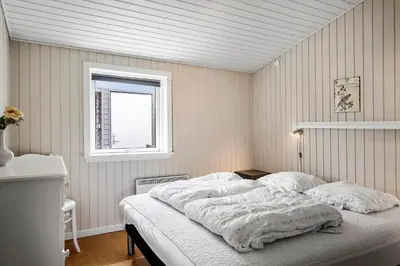 a bed in a bedroom with a window at 514-Thisted-Fiskervej-53 in Thisted