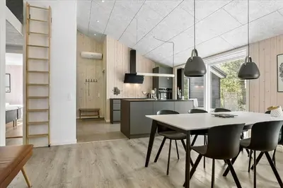 a kitchen and dining room with a table and chairs at 171-Thisted-Molgaardsvej-71 in Thisted