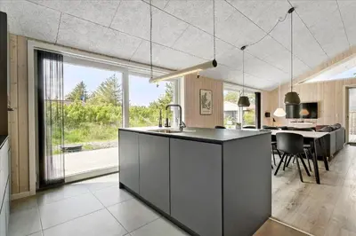 a kitchen and dining room with a large window at 171-Thisted-Molgaardsvej-71 in Thisted