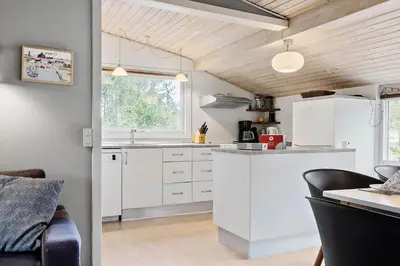 a kitchen with white cabinets and a window at 746-Thisted-Blamunkevej-36 in Thisted