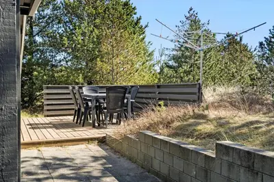a table and chairs sitting on a wooden deck at 746-Thisted-Blamunkevej-36 in Thisted
