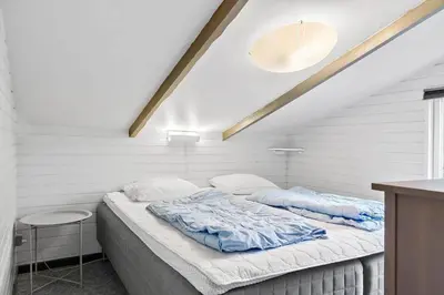 a bed in a room with white walls at 746-Thisted-Blamunkevej-36 in Thisted