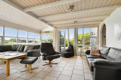 a living room with couches and chairs and a table at 950-Thisted-Mombak-1 in Torsted