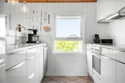 a kitchen with white appliances and a window at 663-Thisted-Nordsovej-166 in Thisted