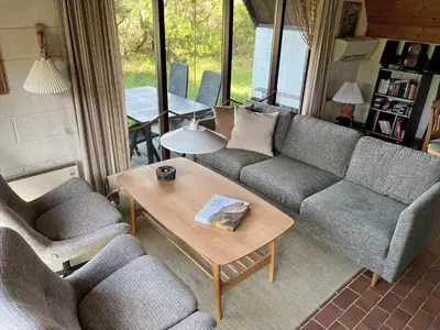 a living room with a couch and two chairs and a table at 875-Thisted-Flyndervej-23 in Thisted
