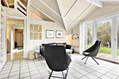 a living room with two chairs and a couch at 435-Vestervig-Sivsangervej-32 in Vestervig