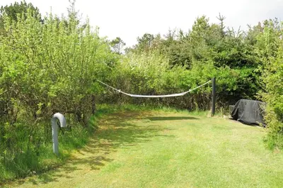 a net in a field with trees and grass at 435-Vestervig-Sivsangervej-32 in Vestervig