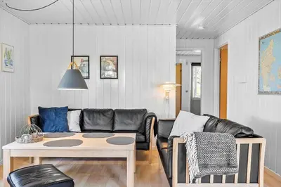 a living room with a couch and a table at 191-Thisted-Bredkaervej-61 in Thisted