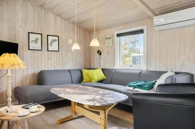 a living room with a couch and a table at 486-Thisted-Fiskervej-57 in Thisted