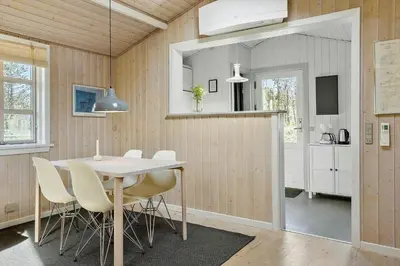 a kitchen and dining room with a table and chairs at 788-Thisted-Blamunkevej-46 in Thisted