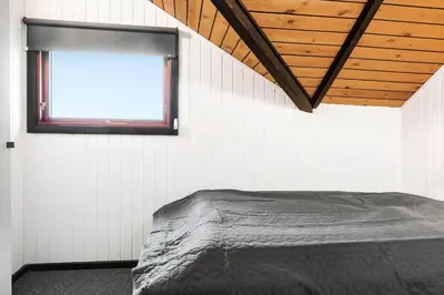 a bedroom with a bed and a window at 896-Thisted-Fiskervej-81 in Thisted