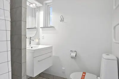 a white bathroom with a sink and a toilet at 404-Thisted-Klemsvej-16 in Thisted