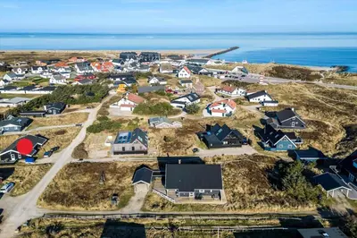 an aerial view of a residential neighborhood with the ocean at 123-Thisted-Orredvej-30 in Thisted