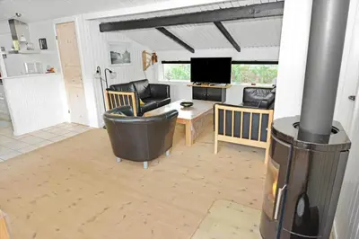 a living room with a couch and a table at 1321-Thisted-Blamunkevej-58 in Thisted