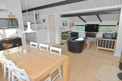 a living room with a table and a couch at 1321-Thisted-Blamunkevej-58 in Thisted