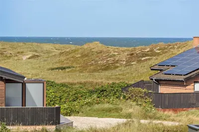 a group of houses with solar panels on a hill at 996-Thisted-Bavnbak-25 in Torsted