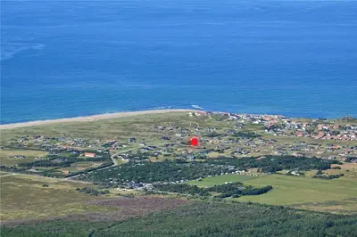 an aerial view of a town with a red frisbee at 996-Thisted-Bavnbak-25 in Torsted
