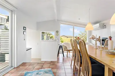 a kitchen and dining room with a table and chairs at 996-Thisted-Bavnbak-25 in Torsted
