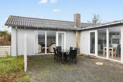 a patio with a table and chairs in a house at 863-Thisted-Gronnevej-12 in Thisted
