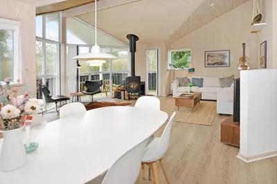 a dining room and living room with a white table and chairs at 170-Thisted-Sotungevej-2 in Thisted