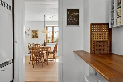 a kitchen and dining room with a table and chairs at 1313-Thisted-Hotelvej-4 in Thisted