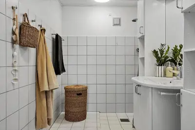 a white bathroom with a sink and a toilet at 1313-Thisted-Hotelvej-4 in Thisted