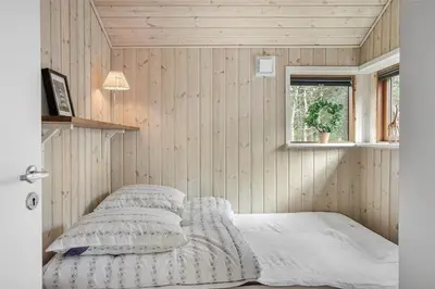 a bedroom with a bed in a room with a window at 748-Thisted-Blamunkevej-65 in Thisted