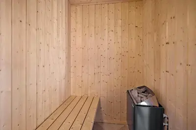 a corner of a room with a bench and a trash can at 878-Thisted-Smedevej-15 in Thisted