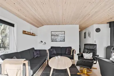 a living room with a couch and a table at 505-Thisted-Fiskervej-50-A in Thisted