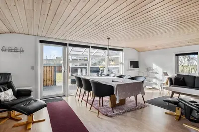 a living room with a dining room table and chairs at 505-Thisted-Fiskervej-50-A in Thisted