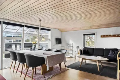 a living room with a table and a couch at 505-Thisted-Fiskervej-50-A in Thisted