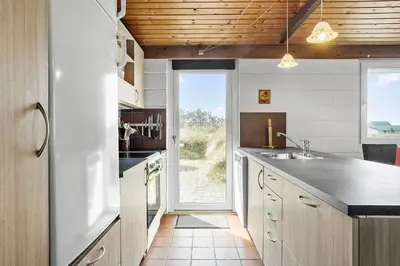 a kitchen with a sink and an open door at 806-Thisted-Nordsovej-39 in Thisted